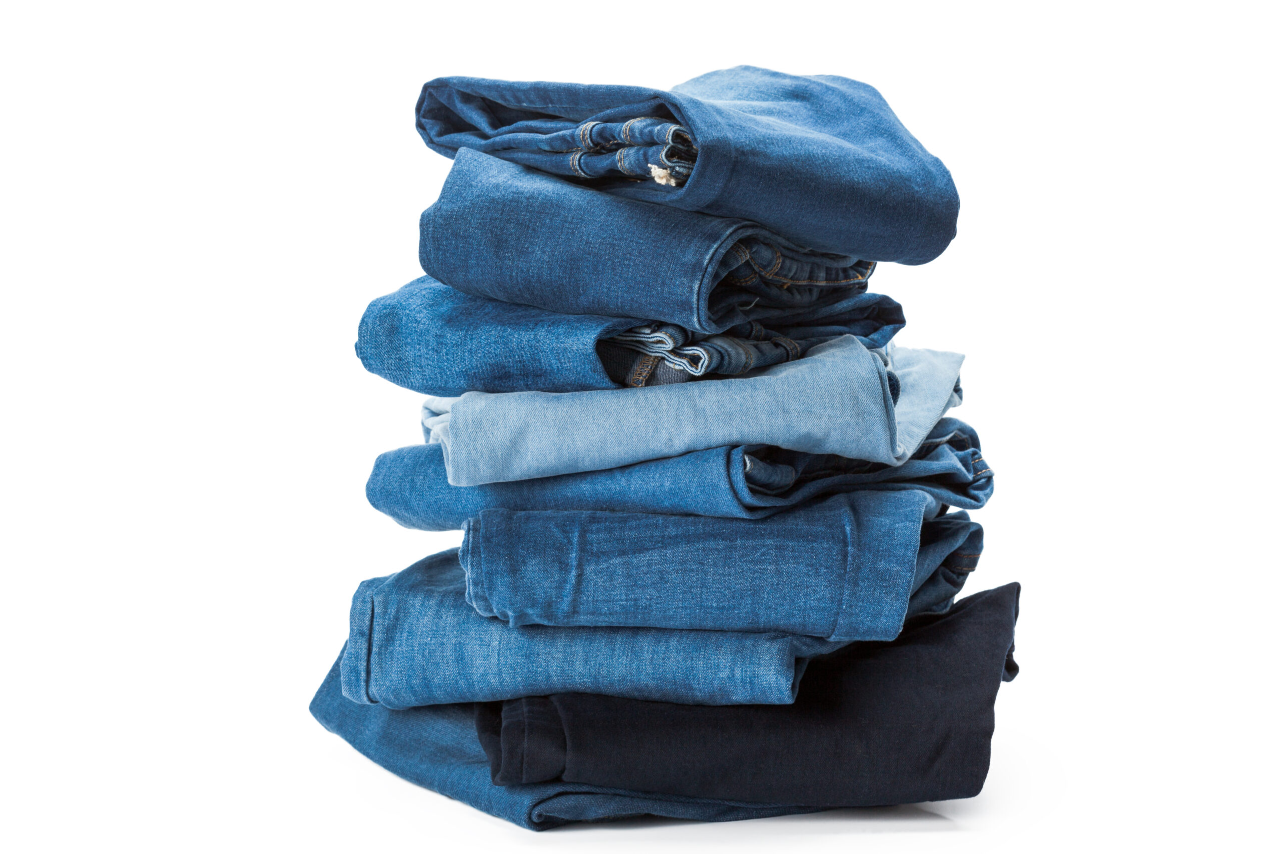Stack of clothes on white background, closeup